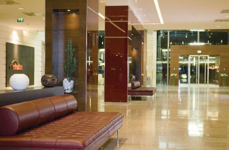 Nh Vienna Airport Conference Center Hotel Schwechat Bagian luar foto Interior of a modern hotel
